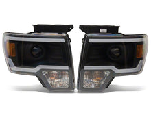 Load image into Gallery viewer, Raxiom 09-14 Ford F-150 Axial Series Projector Headlights w/ LED Light Bar- Blk Housing (Clear Lens)