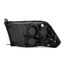Load image into Gallery viewer, AlphaRex 09-18 RAM 1500 PRO-Series Proj Headlights Alpha-Black w/Sequential Signal & Top/Middle DRL