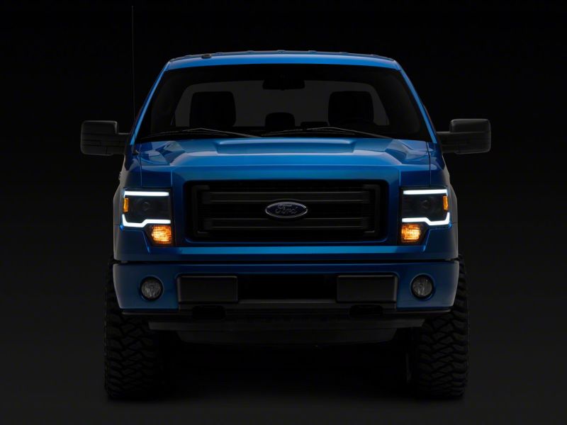 Raxiom 09-14 Ford F-150 Axial Series Projector Headlights w/ LED Light Bar- Blk Housing (Clear Lens)