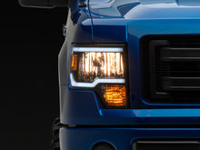 Load image into Gallery viewer, Raxiom 09-14 Ford F-150 Axial Series Headlight w/ SEQL LED Bar- Blk Housing (Clear Lens)