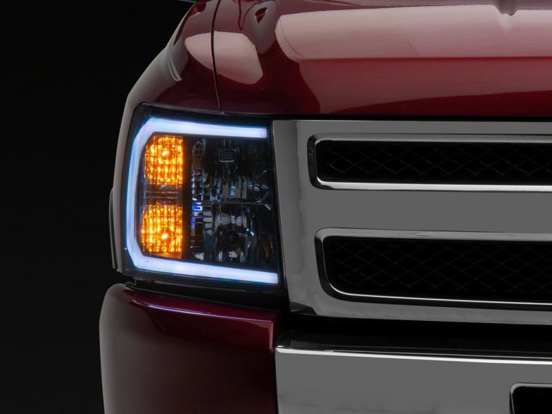 Raxiom 07-13 Chevrolet Silverado 1500 Axial Headlights w/ SEQL LED Bar- Blk Housing (Clear Lens)