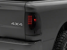 Load image into Gallery viewer, Raxiom 09-18 Dodge RAM 1500/2500/3500 Axial Series LED Tail Lights- BlkHousing- SmokedLens