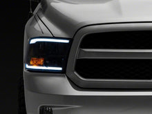 Load image into Gallery viewer, Raxiom 09-18 Dodge RAM 1500/2500/3500 Axial Series Headlights w/ LED Bar- Blk Housing (Clear Lens)