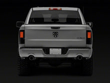 Load image into Gallery viewer, Raxiom 09-18 Dodge RAM 1500/2500/3500 Axial Series LED Tail Lights- BlkHousing- SmokedLens