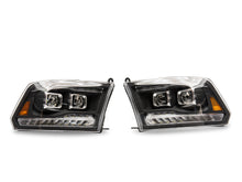 Load image into Gallery viewer, Raxiom 09-18 RAM 1500 LED Projector Headlights w/ Switchback Turn Signals- Blk Housing (Clear Lens)