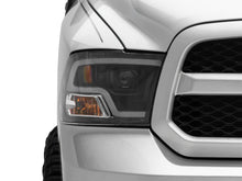 Load image into Gallery viewer, Raxiom 09-18 RAM 1500 LED Halo Projector Headlights- Black Housing (Clear Lens)